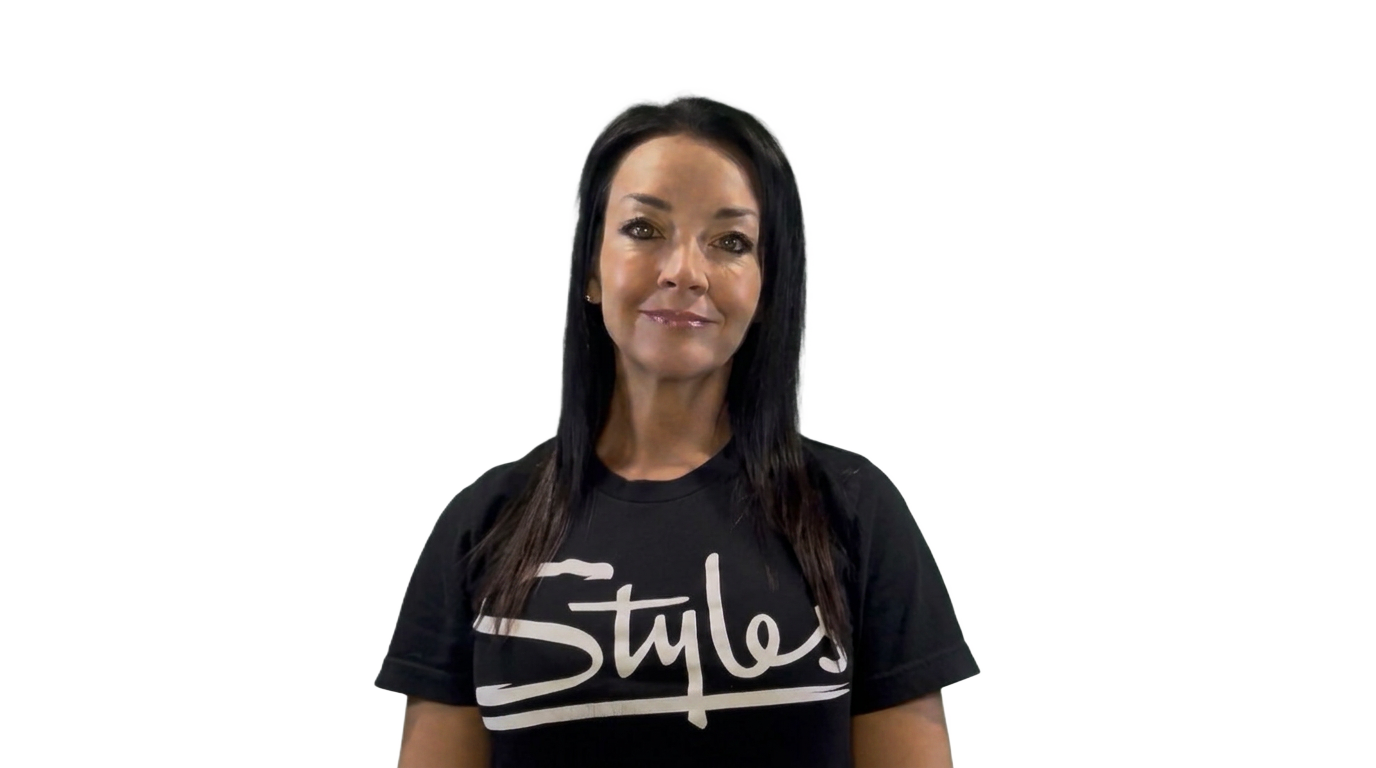 Carrie, founder of Styles Studios Fitness, standing in the Styles Coach studio